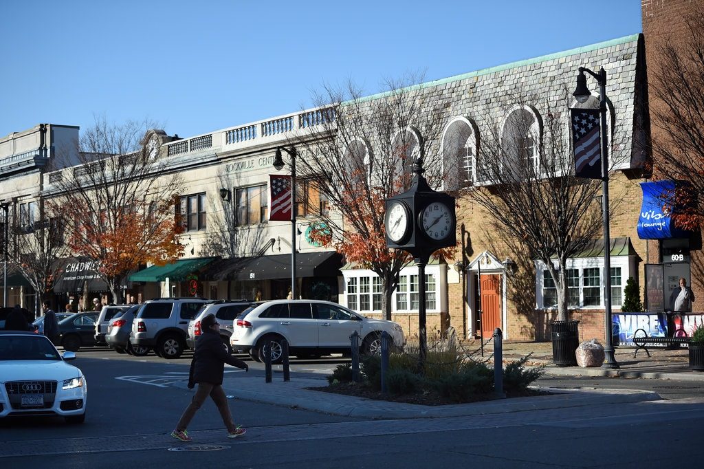 A pedestrian crosses Front Street, in Rockville Centre.Credit...Kathy Kmonicek for The New York Times